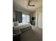 Comfortable bedroom with queen bed, window, and ample closet space at 7760 Sandy Ridge Dr # 214, Kissimmee, FL 34747