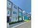 Modern townhome community with teal and white exteriors at 7760 Sandy Ridge Dr # 214, Kissimmee, FL 34747