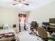 Bright bedroom with a double bed, nightstand, and desk at 3917 Pemberly Pines Cir, Saint Cloud, FL 34769