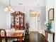 Elegant dining room features a wood table, chairs, and a china cabinet at 3917 Pemberly Pines Cir, Saint Cloud, FL 34769