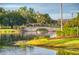 Picturesque stone bridge over calm lake, surrounded by trees at 154 Rancho Mirage Dr, Kissimmee, FL 34759