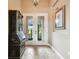 Bright and spacious entryway with tile flooring and a charming secretary at 154 Rancho Mirage Dr, Kissimmee, FL 34759