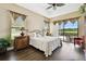 Spacious bedroom with king-size bed and access to backyard patio at 154 Rancho Mirage Dr, Kissimmee, FL 34759