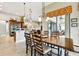 Kitchen dining area with wooden table and chairs, view to backyard at 154 Rancho Mirage Dr, Kissimmee, FL 34759
