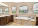 Bathroom with a large soaking tub and and sinks at 154 Rancho Mirage Dr, Kissimmee, FL 34759