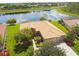 Single-Gathering home with a tile roof, situated by a lake at 154 Rancho Mirage Dr, Kissimmee, FL 34759