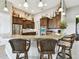 Island kitchen with stainless steel appliances and dark wood cabinets at 154 Rancho Mirage Dr, Kissimmee, FL 34759