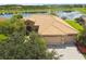 Aerial view of a single Gathering home with lake view and two car garage at 154 Rancho Mirage Dr, Kissimmee, FL 34759
