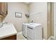 Laundry room with washer, dryer, and cabinets at 154 Rancho Mirage Dr, Kissimmee, FL 34759