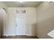 A bright entryway with a white door and tiled floor at 108 Country Walk Cir, Davenport, FL 33837