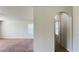 Interior view showing a carpeted living room and hallway at 108 Country Walk Cir, Davenport, FL 33837