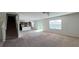 Spacious living room with an open floor plan and carpet flooring at 108 Country Walk Cir, Davenport, FL 33837