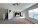 Spacious living room with an open floor plan and carpet flooring at 108 Country Walk Cir, Davenport, FL 33837