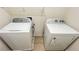 White Whirlpool washer and dryer in a laundry room at 108 Country Walk Cir, Davenport, FL 33837