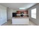 Modern kitchen with brown cabinets and granite countertops at 108 Country Walk Cir, Davenport, FL 33837