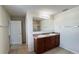 Bathroom with double vanity, large mirror, and shower/tub combo at 108 Country Walk Cir, Davenport, FL 33837