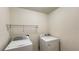 Laundry room with washer, dryer, and overhead shelving at 108 Country Walk Cir, Davenport, FL 33837