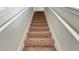 Carpeted staircase leading to the second floor at 108 Country Walk Cir, Davenport, FL 33837