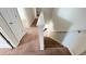 Indoor staircase with carpeted steps and neutral-colored walls at 108 Country Walk Cir, Davenport, FL 33837