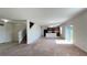 Spacious living room with an open floor plan and carpet flooring at 108 Country Walk Cir, Davenport, FL 33837