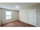 Well-lit bedroom featuring carpeted floors and a closet at 108 Country Walk Cir, Davenport, FL 33837