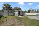 Spacious backyard with a detached building, a swing set, and privacy fence at 5051 Plymouth Turtle Cir, St Cloud, FL 34772