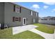 Backyard patio with a concrete slab and access to the home's interior at 5051 Plymouth Turtle Cir, St Cloud, FL 34772