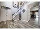 The foyer shows wood-look tile, decorative accents, and views into adjacent rooms at 5051 Plymouth Turtle Cir, St Cloud, FL 34772