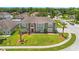 Two story house with green exterior and large yard at 5051 Plymouth Turtle Cir, St Cloud, FL 34772