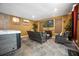 Living area with a hot tub, fireplace, and comfortable seating at 5051 Plymouth Turtle Cir, St Cloud, FL 34772