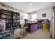 Home office with built-in bookshelves, desk, and ample storage at 5051 Plymouth Turtle Cir, St Cloud, FL 34772