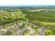 Aerial view showing home's location in a residential neighborhood near a golf course at 5051 Plymouth Turtle Cir, St Cloud, FL 34772
