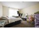 Bedroom with a treadmill and comfortable bed at 5051 Plymouth Turtle Cir, St Cloud, FL 34772