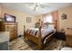 Cozy bedroom with wood flooring and a double bed at 5051 Plymouth Turtle Cir, St Cloud, FL 34772