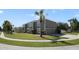 Two-story house with a two-car garage, palm trees, and a landscaped lawn at 5051 Plymouth Turtle Cir, St Cloud, FL 34772