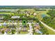 Aerial view showing home's location in a residential neighborhood near a golf course at 5051 Plymouth Turtle Cir, St Cloud, FL 34772