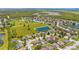 Aerial view of a residential neighborhood with a pond at 5051 Plymouth Turtle Cir, St Cloud, FL 34772