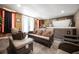 Hot tub and seating area in a finished basement with tile flooring at 5051 Plymouth Turtle Cir, St Cloud, FL 34772