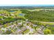 Aerial view showing home's location in a residential neighborhood near a golf course at 5051 Plymouth Turtle Cir, St Cloud, FL 34772