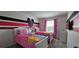 Minnie Mouse-themed bedroom with twin beds, and a window at 1539 Carey Palm Circle Pl, Kissimmee, FL 34747