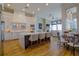 Modern kitchen boasts white cabinetry, large island, and breakfast nook at 4962 Lazy Oaks Way, St Cloud, FL 34771
