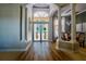Grand entryway with high ceilings, stained glass doors, and hardwood floors at 4962 Lazy Oaks Way, St Cloud, FL 34771