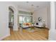 Bright living room with hardwood floors, comfy sofas, and access to a waterfront view at 4962 Lazy Oaks Way, St Cloud, FL 34771