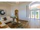 Elegant living room with a glass-top coffee table and comfortable seating at 4962 Lazy Oaks Way, Saint Cloud, FL 34771