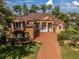 Luxury home with a large driveway and landscaped yard at 4962 Lazy Oaks Way, St Cloud, FL 34771