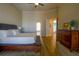 Bright main bedroom with hardwood floors and access to bathroom at 4962 Lazy Oaks Way, St Cloud, FL 34771