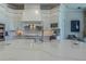Luxury kitchen with white cabinets, quartz countertops, and a large range hood at 4962 Lazy Oaks Way, St Cloud, FL 34771