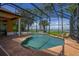 Relaxing pool area with screened enclosure and lake view at 4962 Lazy Oaks Way, St Cloud, FL 34771