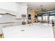 Modern kitchen with white cabinets, expansive island, and high end appliances at 4962 Lazy Oaks Way, St Cloud, FL 34771