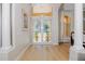 Bright entryway featuring double doors with pineapple-themed stained glass at 4962 Lazy Oaks Way, St Cloud, FL 34771